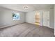 Bedroom with ensuite bathroom and a large window at 10350 Sw 62Nd Terrace Rd, Ocala, FL 34476