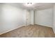 Neutral bedroom with light-colored walls, carpeting and door at 10350 Sw 62Nd Terrace Rd, Ocala, FL 34476