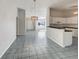 Spacious living room with tile flooring and adjacent kitchen at 10350 Sw 62Nd Terrace Rd, Ocala, FL 34476