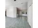 Open living room features sleek floors, chandelier, and eat-in kitchen bar at 10350 Sw 62Nd Terrace Rd, Ocala, FL 34476