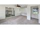 Sun room with ceiling fan, connecting to the kitchen through sliding glass doors at 10350 Sw 62Nd Terrace Rd, Ocala, FL 34476