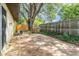 The backyard has a concrete area, large trees and a wood fence at 109 Long Leaf Pine Cir, Sanford, FL 32773
