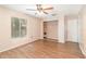 Bedroom with wood-look flooring, a ceiling fan, closet, and natural light at 109 Long Leaf Pine Cir, Sanford, FL 32773