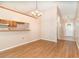 Dining room features hardwood floors and a view into the kitchen at 109 Long Leaf Pine Cir, Sanford, FL 32773