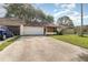 Single-story home with an attached garage, driveway, and front yard at 109 Long Leaf Pine Cir, Sanford, FL 32773