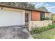 Home exterior with garage, driveway, front door and small garden at 109 Long Leaf Pine Cir, Sanford, FL 32773