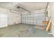 This garage has a garage door, a refrigerator and carpet at 109 Long Leaf Pine Cir, Sanford, FL 32773