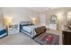 Cozy bedroom features a plush bed, ample natural light, and stylish decor; perfect for relaxation at 11213 Grander Dr, Windermere, FL 34786