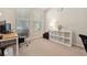 Home office with carpeted floors, lots of light, modern desk and chair at 11213 Grander Dr, Windermere, FL 34786