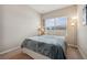 Serene bedroom with soft lighting, a comfortable bed, and a large window; perfect relaxation at 11213 Grander Dr, Windermere, FL 34786