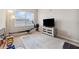 Spacious exercise room with workout equipment and natural light; perfect space for a home gym at 11213 Grander Dr, Windermere, FL 34786