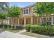 Well-maintained home with lush landscaping, covered entry, and inviting porch at 11213 Grander Dr, Windermere, FL 34786
