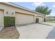 Row of garages shows well-maintained exteriors and landscaping in a community setting at 11213 Grander Dr, Windermere, FL 34786