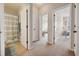 Hallway view showcasing doorways to the bathroom and bedrooms; functional and well-lit space at 11213 Grander Dr, Windermere, FL 34786
