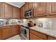 Gourmet kitchen featuring granite countertops and stainless steel appliances at 11213 Grander Dr, Windermere, FL 34786