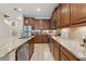 Modern kitchen featuring granite countertops, stainless steel appliances, and ample cabinet space at 11213 Grander Dr, Windermere, FL 34786