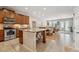 View of the kitchen with a center island with seating, stainless steel appliances, and dining area at 11213 Grander Dr, Windermere, FL 34786