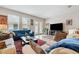 Comfortable living room with plenty of seating, natural light, and entertainment center at 11213 Grander Dr, Windermere, FL 34786