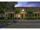 Charming townhome featuring mature trees, and manicured shrubs enhances curb appeal at 11213 Grander Dr, Windermere, FL 34786