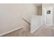 Upstairs hallway features neutral paint and carpeted floor at 11213 Grander Dr, Windermere, FL 34786