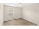 Neutral bedroom with a window bringing in natural light at 11225 Cypress Trail Dr, Orlando, FL 32825