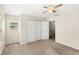 Bright bedroom with neutral carpet, closet, and ceiling fan at 11225 Cypress Trail Dr, Orlando, FL 32825