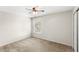 Neutral bedroom with a window and ceiling fan with lights at 11225 Cypress Trail Dr, Orlando, FL 32825