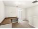 Bonus room featuring a built-in desk on the second floor with neutral carpeting at 11225 Cypress Trail Dr, Orlando, FL 32825