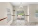 Cozy dining area with a view of the sparkling pool and a landscaped backyard at 11225 Cypress Trail Dr, Orlando, FL 32825