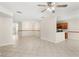 Expansive living room with tile flooring, with partial view of the kitchen at 11225 Cypress Trail Dr, Orlando, FL 32825
