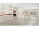 Expansive open-concept living area with tile flooring, neutral walls, and great natural light at 11225 Cypress Trail Dr, Orlando, FL 32825