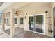 Outdoor patio with brick floor and ceiling fan overlooking pool at 11225 Cypress Trail Dr, Orlando, FL 32825