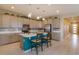 Stylish kitchen featuring a center island with seating, modern appliances, and pendant lighting at 1132 Sugarwood St, Davenport, FL 33837