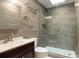 Sleek bathroom featuring a tiled shower with glass door, modern vanity, and updated fixtures at 1308 S Pennsylvania Ave # 3, Winter Park, FL 32789