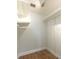 A bright, walk-in closet featuring wood floors, built in shelving and ample storage at 1308 S Pennsylvania Ave # 3, Winter Park, FL 32789