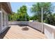 A wooden deck with white railing and multiple entry doors, perfect for outdoor entertaining at 1308 S Pennsylvania Ave # 3, Winter Park, FL 32789
