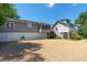 Exterior view of home featuring gravel driveway and white garage doors at 1308 S Pennsylvania Ave # 3, Winter Park, FL 32789