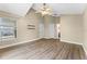 Bedroom featuring wood floors, a window, and neutral walls for a relaxing retreat at 13146 Odyssey Lake Way, Orlando, FL 32826