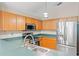 Updated kitchen features stainless steel appliances and ample counter space at 13146 Odyssey Lake Way, Orlando, FL 32826
