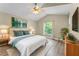 Cozy main bedroom with an accent wall, and a ceiling fan at 13146 Odyssey Lake Way, Orlando, FL 32826