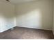 Neutral bedroom offering comfortable carpet, base trim, and electrical outlets along the wall at 1325 Bella Coola Dr, Orlando, FL 32828