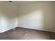 Neutral bedroom offering comfortable carpet, base trim, and electrical outlets along the wall at 1325 Bella Coola Dr, Orlando, FL 32828