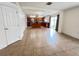 Open-concept living area featuring tile floors and a view into the kitchen and sliding glass door access at 1325 Bella Coola Dr, Orlando, FL 32828