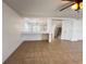 Living room featuring an open floor plan, tile floors, and stairs to the second floor at 1325 Bella Coola Dr, Orlando, FL 32828