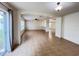 Bright living room featuring a sliding glass door to the backyard, and passthrough to another living space at 1325 Bella Coola Dr, Orlando, FL 32828