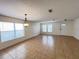 Bright living room features tile flooring and ample natural light from large windows at 1325 Bella Coola Dr, Orlando, FL 32828