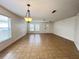 Bright living room features tile flooring and ample natural light from large windows at 1325 Bella Coola Dr, Orlando, FL 32828