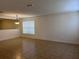 Bright living room with tile flooring, window and stairs leading to second level at 1325 Bella Coola Dr, Orlando, FL 32828