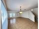 Open-concept living room with tile flooring, lots of natural light, and a staircase in view at 1325 Bella Coola Dr, Orlando, FL 32828