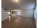 Bright living room with tile flooring, two windows and stairs leading to second level at 1325 Bella Coola Dr, Orlando, FL 32828